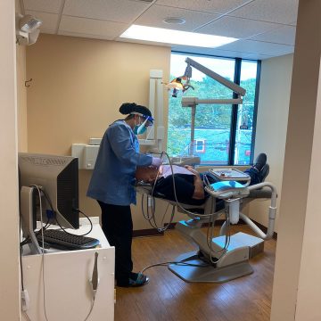 Dentist with Patient in Operator Room